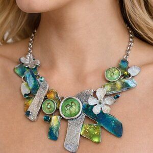 Ikita (Paris) marked silver tone necklace, poured glass over foil